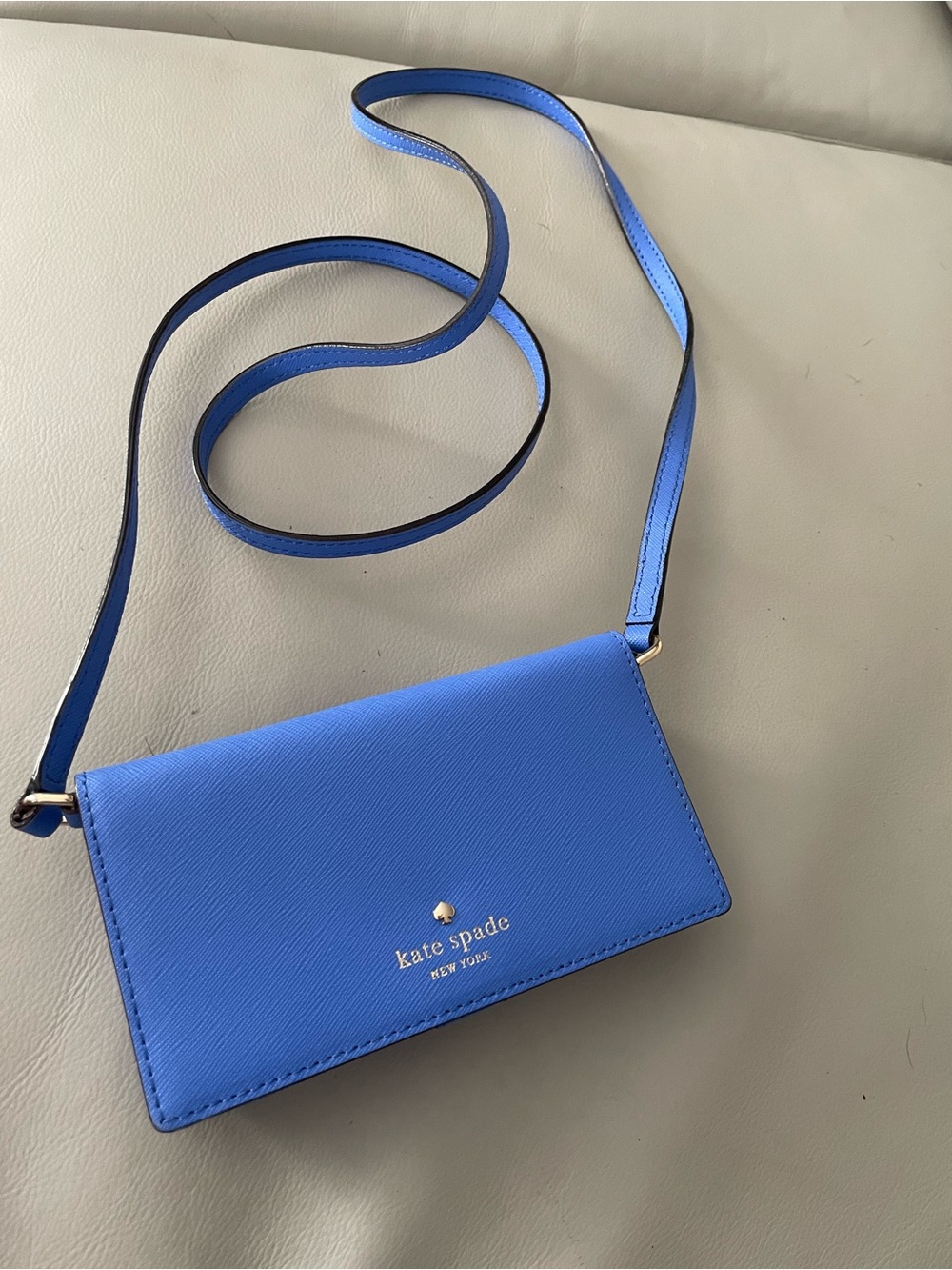 kate spade Bright Blue Crossbody Wallet with Gold Logo